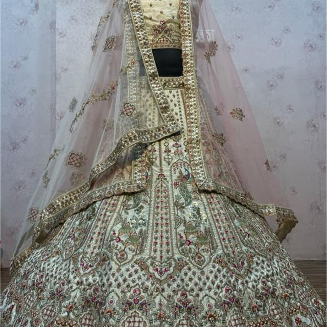 Ivory, Gold, Pink, Green, and hints of other vibrant colors Lehenga Choli with Dupatta