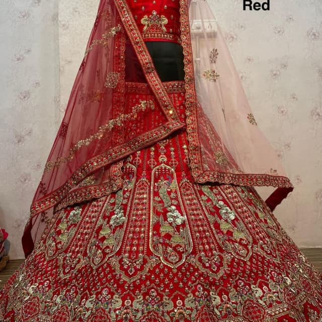 Red, Gold, and hints of other colors in the embroidery Lehenga Choli