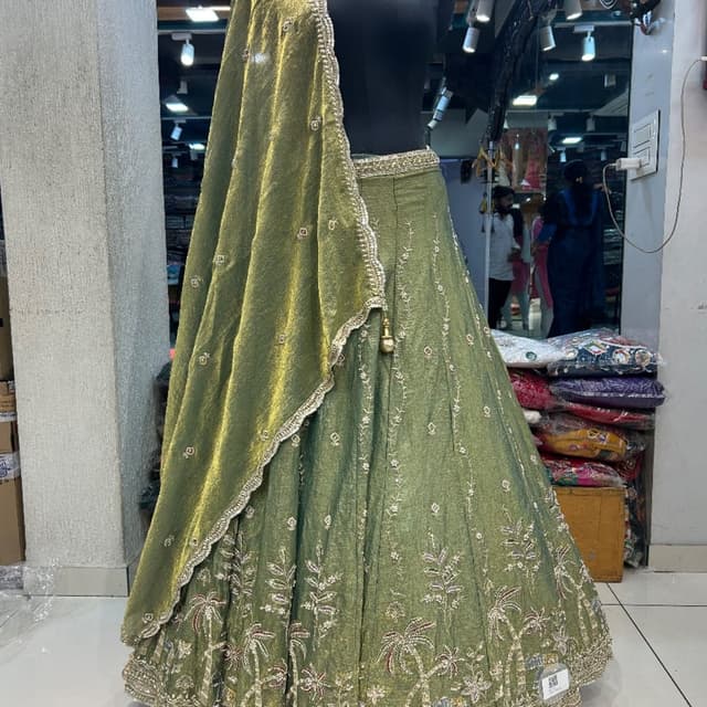 Olive Green, Silver, Gold, and touches of pastel colors in the embroidery Lehenga Choli with Dupatta