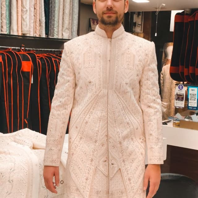 Ivory and beige with subtle gold accents Sherwani