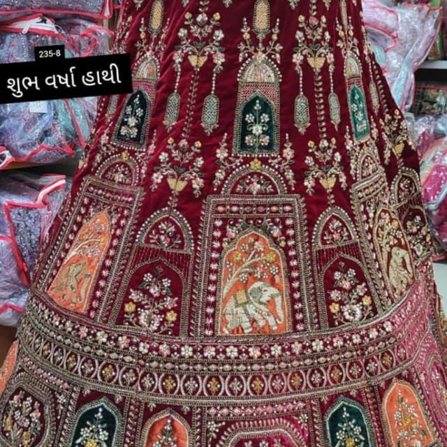 Burgundy, with accents of orange, green, gold, and white Lehenga