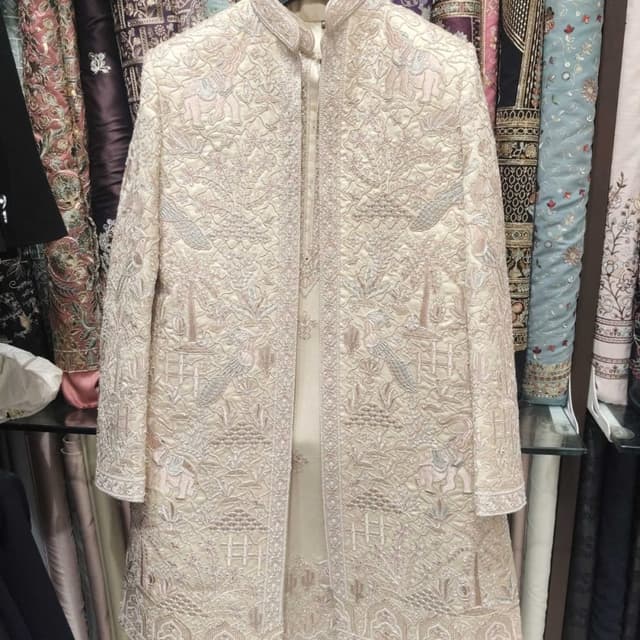 Ivory and muted pastel pinks and silvers Sherwani