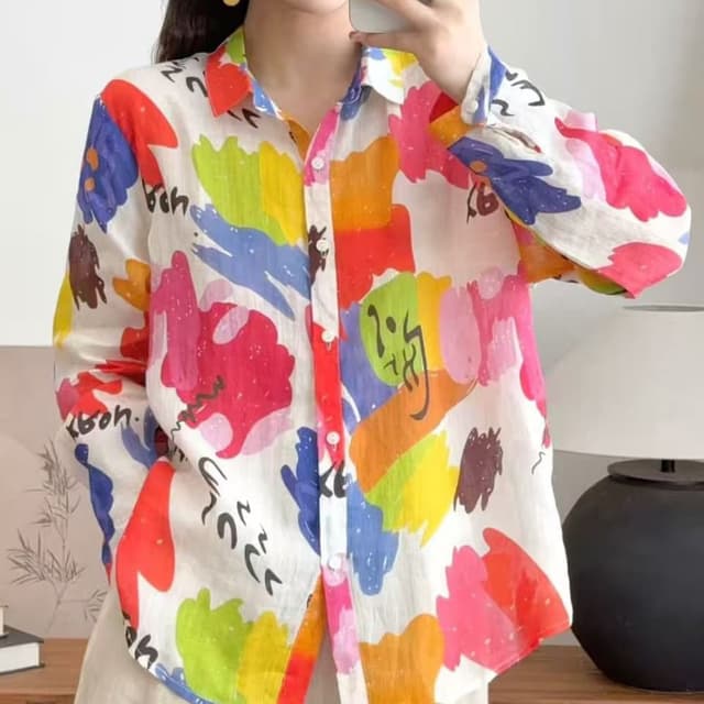 Multicolor with a white base. The primary colors include red, orange, yellow, green, blue, and pink. Shirt