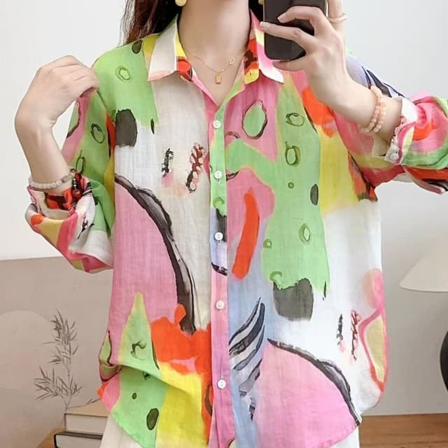 Multicolor with dominant shades of pink, green, orange, and white. Shirt
