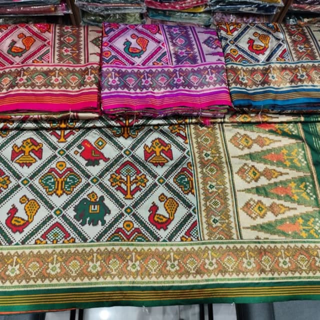 Vibrant and diverse, including shades of pink, purple, green, yellow, red, and gold, creating a rich and eye-catching palette. Saree