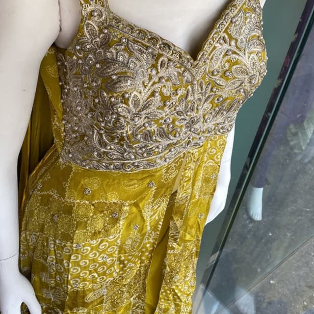 Mustard Yellow with Silver and White Embellishments Anarkali Suit Set (implied, with heavily embellished yoke and flowing kurta/skirt)