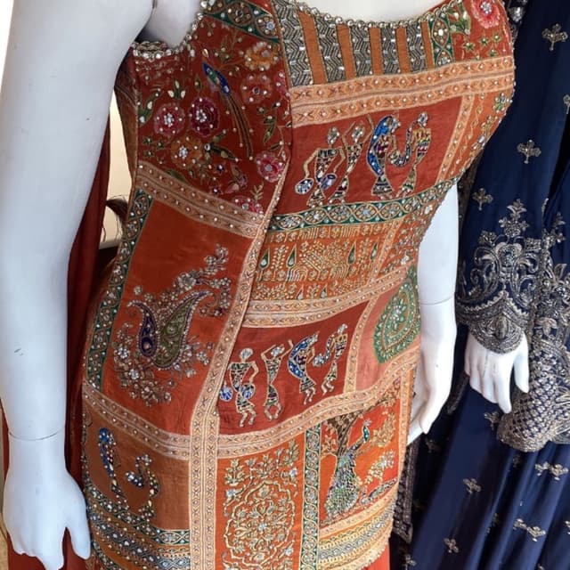 Rust Orange, with multi-color embroidery and silver embellishments Lehenga Choli