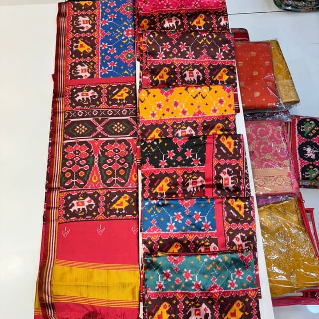 Multicolor (featuring red, yellow, blue, brown, black, green, pink, white) Saree (or fabric for ethnic wear)