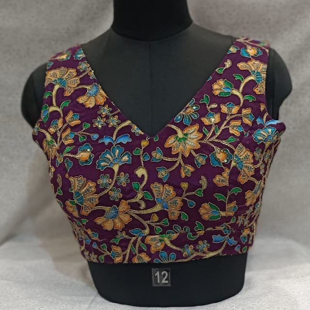 Purple with floral embroidery in orange, blue, green, and gold Blouse