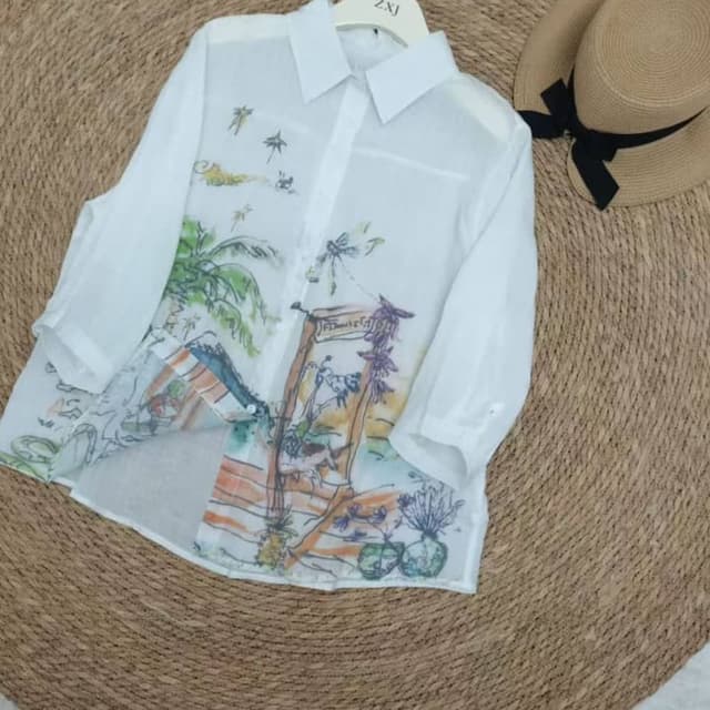 White base with multi-colored tropical print (greens, blues, oranges, purples) Shirt