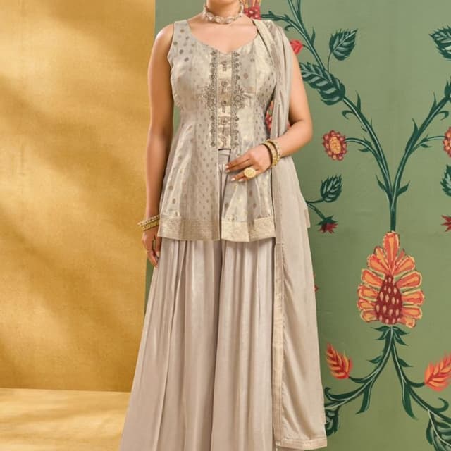 Beige, Gold, and hints of muted red and orange in the backdrop Sharara Suit