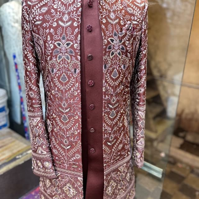 Maroon with intricate embroidery in silver, gold, and purple hues Sherwani