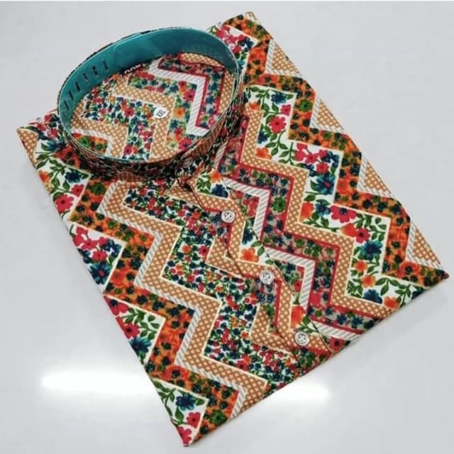 Multicolor with a base of white, featuring vibrant floral prints in red, orange, blue, and green, accented by geometric brown and white patterns Shirt
