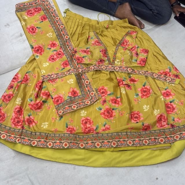 Mustard yellow with red and green floral print, embellished with multicolored thread work Lehenga Choli