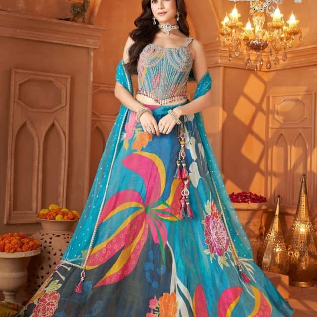 Teal blue with vibrant floral prints in pink, yellow, orange, and white Lehenga Choli