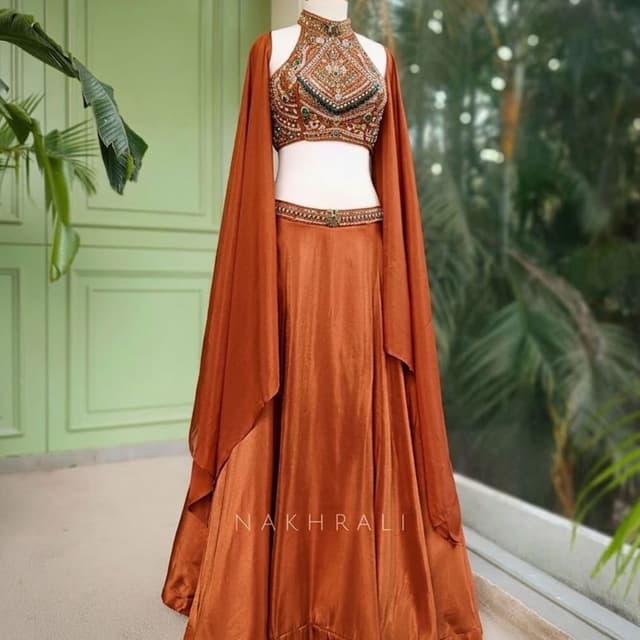 Burnt orange, gold, green accents Lehenga Choli with cape