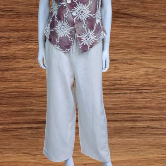 Purple and white floral print on the top, off-white pants Sleeveless top and wide-leg pants set