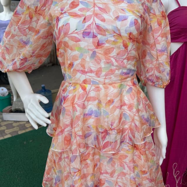 Pastel floral print with shades of pink, orange, yellow, and purple on a white base Dress