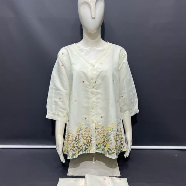 Off-white with floral embroidery in yellow, green, blue, pink, and red Kurti