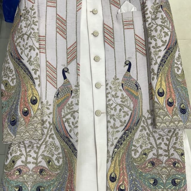 White, gold, multicolor (peacock feathers), peach, pink, blue, green, yellow Sherwani