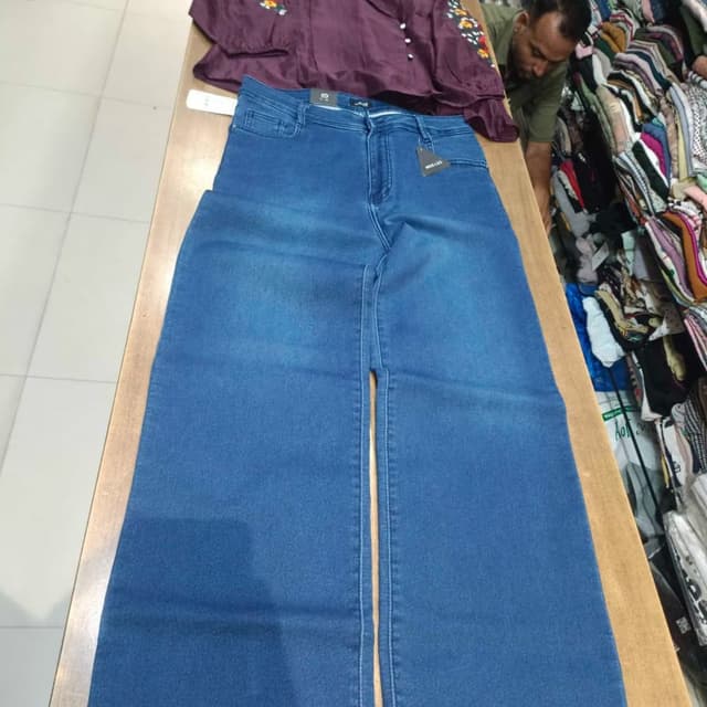 Blue denim with burgundy top Wide-leg jeans and a cropped blouse