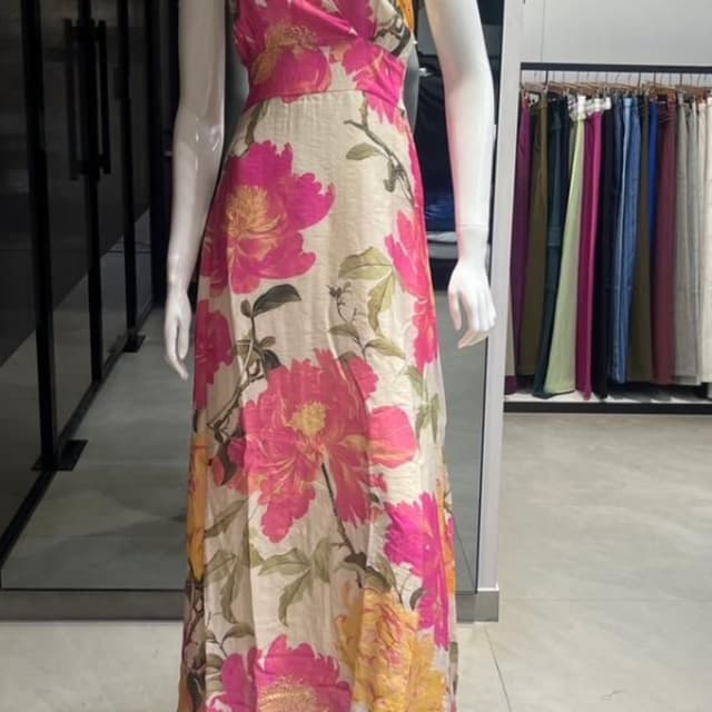 Cream base with vibrant floral print in shades of fuchsia, pink, and yellow. Dress