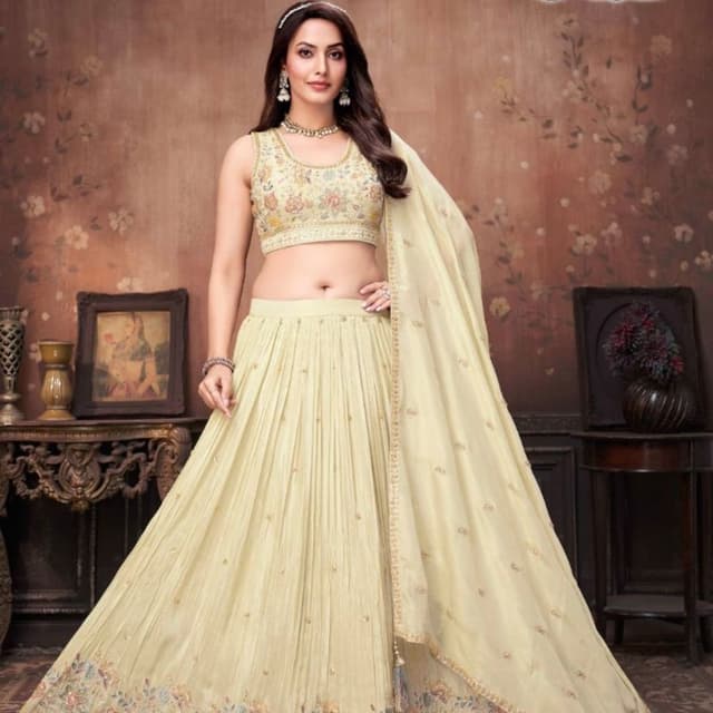 Cream, Pastel floral tones (pink, yellow, blue), Gold Lehenga Choli with Dupatta
