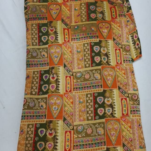 Multicolor with dominant shades of orange, green, yellow, and brown Fabric, likely for a Saree or Lehenga Choli