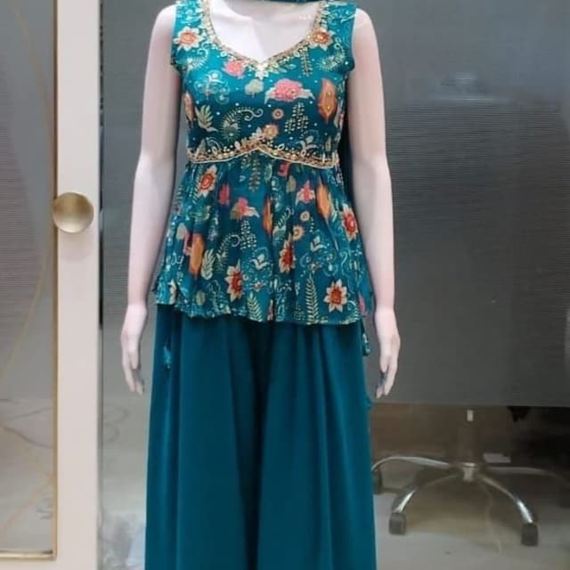Teal, deep green, with orange, pink, and white floral accents Peplum top with palazzo pants set