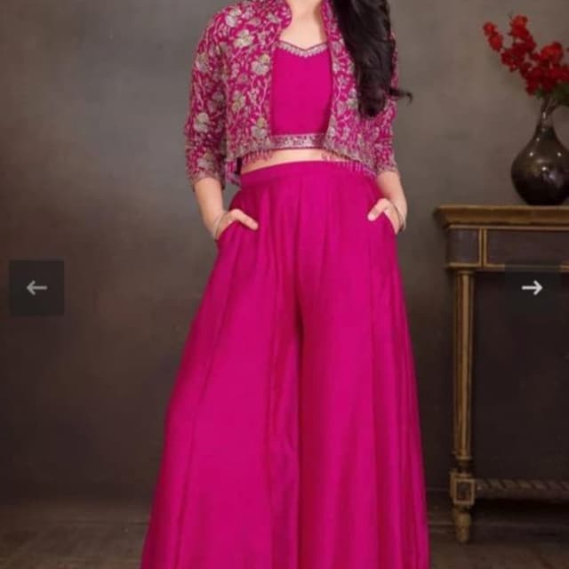 Fuchsia pink with floral embroidery in pink, green, and gold Crop top with palazzo pants and jacket