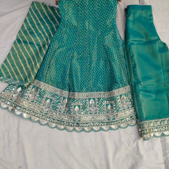 Teal green with silver and light yellow accents Lehenga Choli