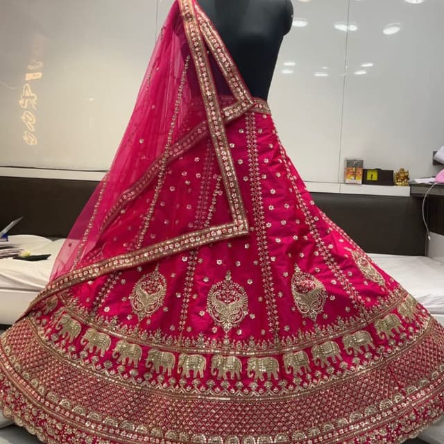 Fuchsia with gold embellishments Lehenga Choli