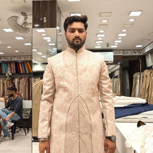 Beige with subtle pinkish undertones and gold embroidery Sherwani