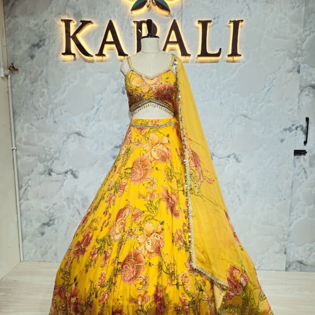 Yellow with floral prints in shades of pink, orange, and green Lehenga Choli