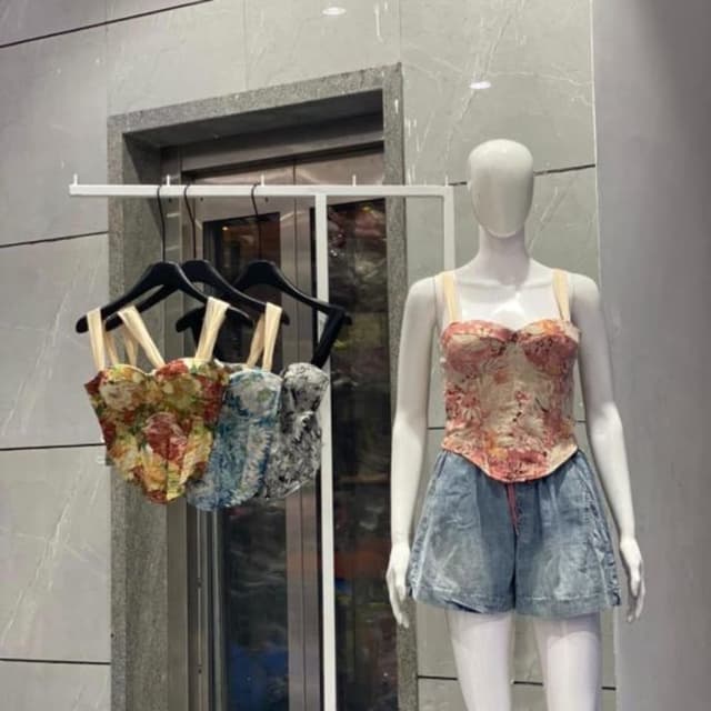 Floral print with dominant colors like red, yellow, green, blue, and grey Corset Top