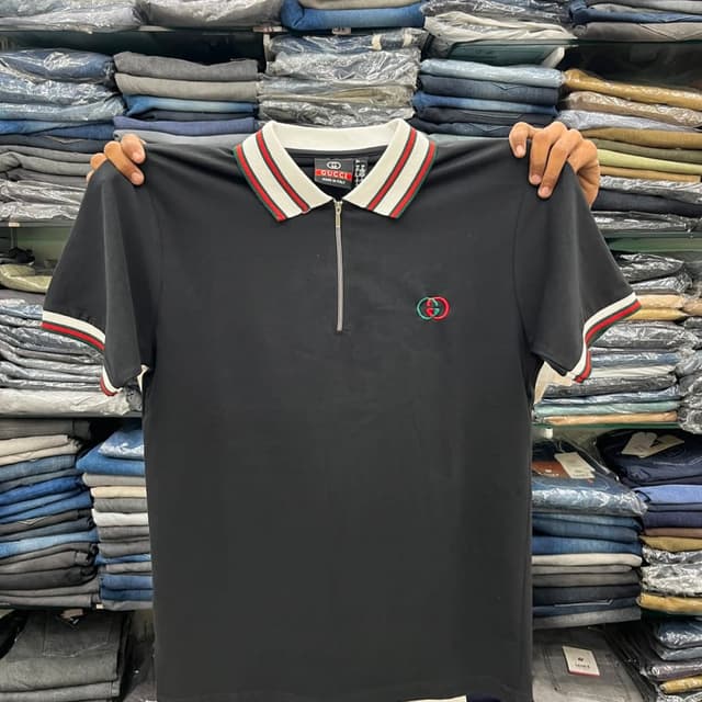 Black with white, red, and green accents Polo Shirt
