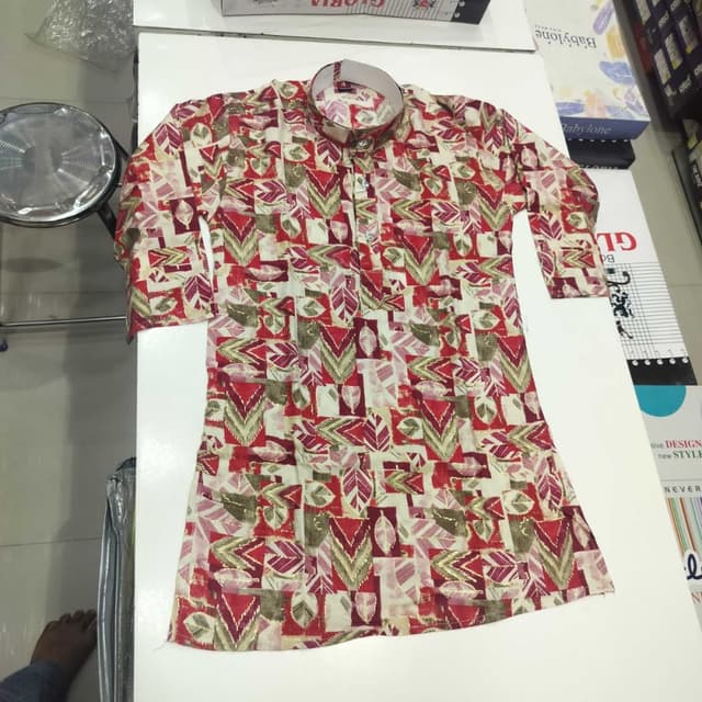 Red, cream, green, and brown abstract leaf and geometric pattern Kurta
