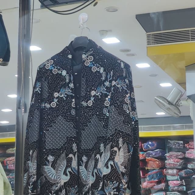 Black with blue, white, and silver accents Sherwani