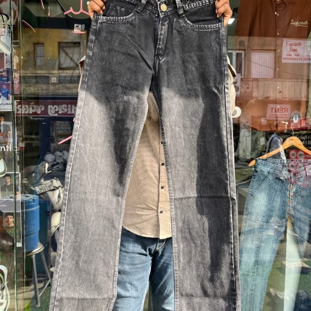 Charcoal Grey with a faded, acid-wash effect Jeans
