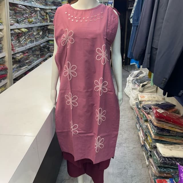 Rosewood pink with white floral patterns and silver embellishments on the yoke Kurta with Palazzo pants