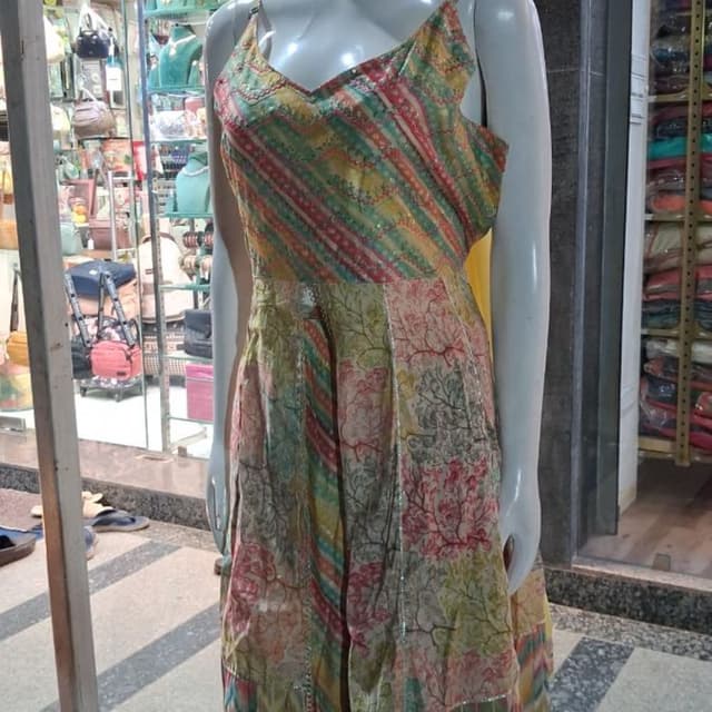 Multi-colored featuring yellow, green, pink, and orange tones Dress