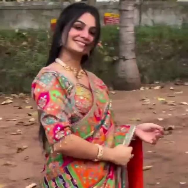 Multicolor with dominant shades of orange, pink, green, and purple Saree and Blouse