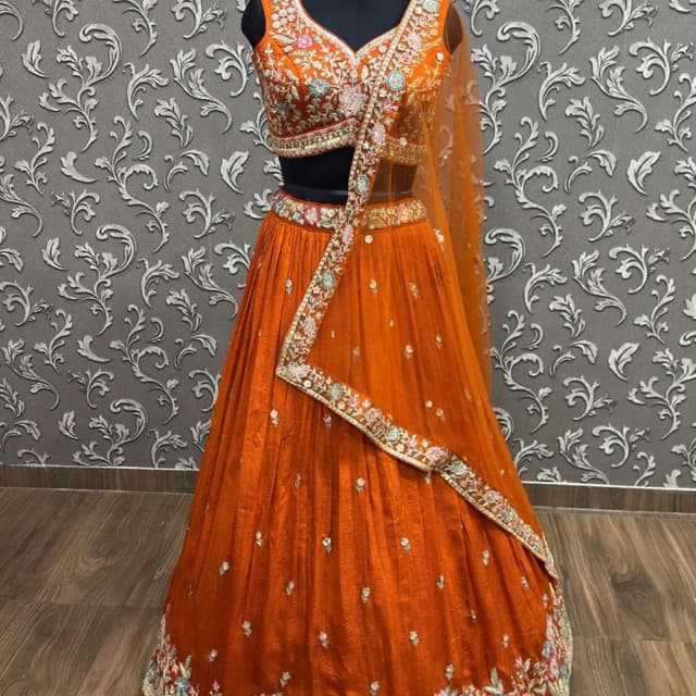 Burnt Orange, Multi-colored floral accents, Gold embellishments Lehenga Choli