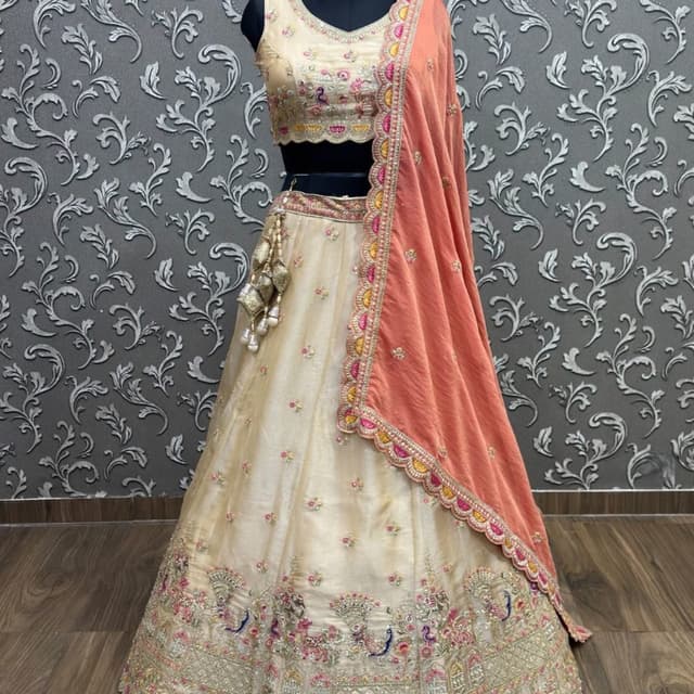 Chiku (Beige/Cream) base with Peach, Pink, and Gold accents Lehenga Choli