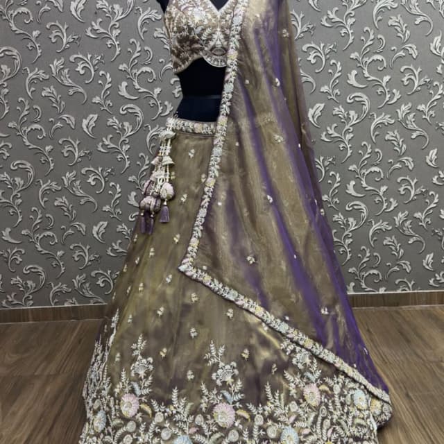 Deep purple and muted gold with pastel accents of pink, yellow, and blue Lehenga Choli