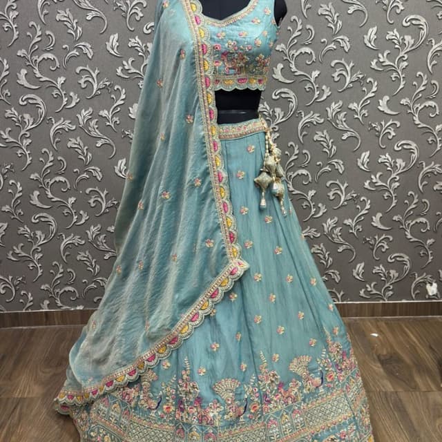 Seafoam green base with pink, yellow, and metallic gold accents Lehenga Choli