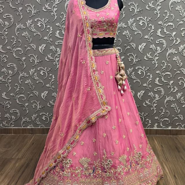 Pink base with multi-colored thread work including yellow, blue, and gold metallic accents Lehenga Choli