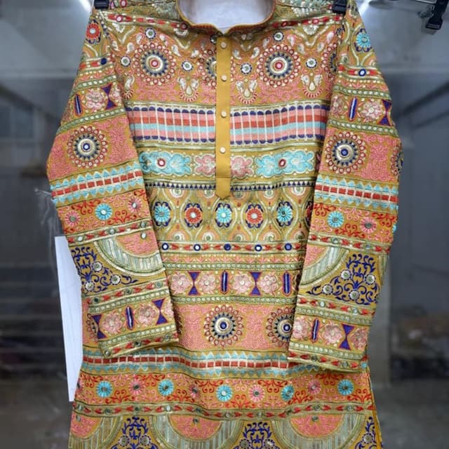 Mustard Yellow base with multi-colored accents including Pink, Blue, Orange, and Green Kurta