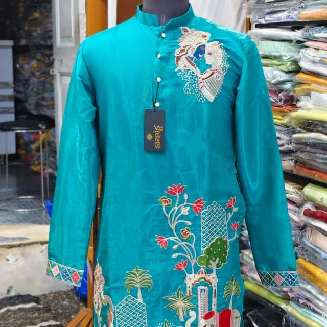Teal base with multi-color embroidery including red, green, white, blue, and gold Kurta