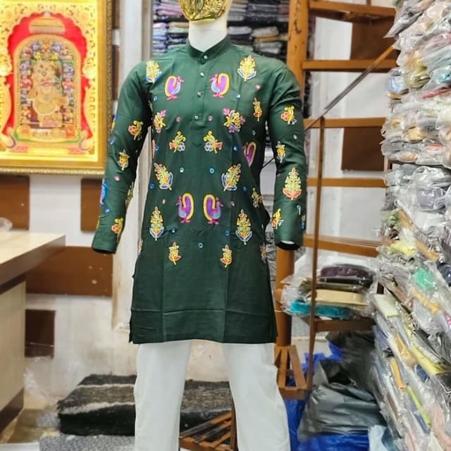 Dark green base with multi-colored embroidery (pink, yellow, blue) and white trousers Kurta Pyjama set